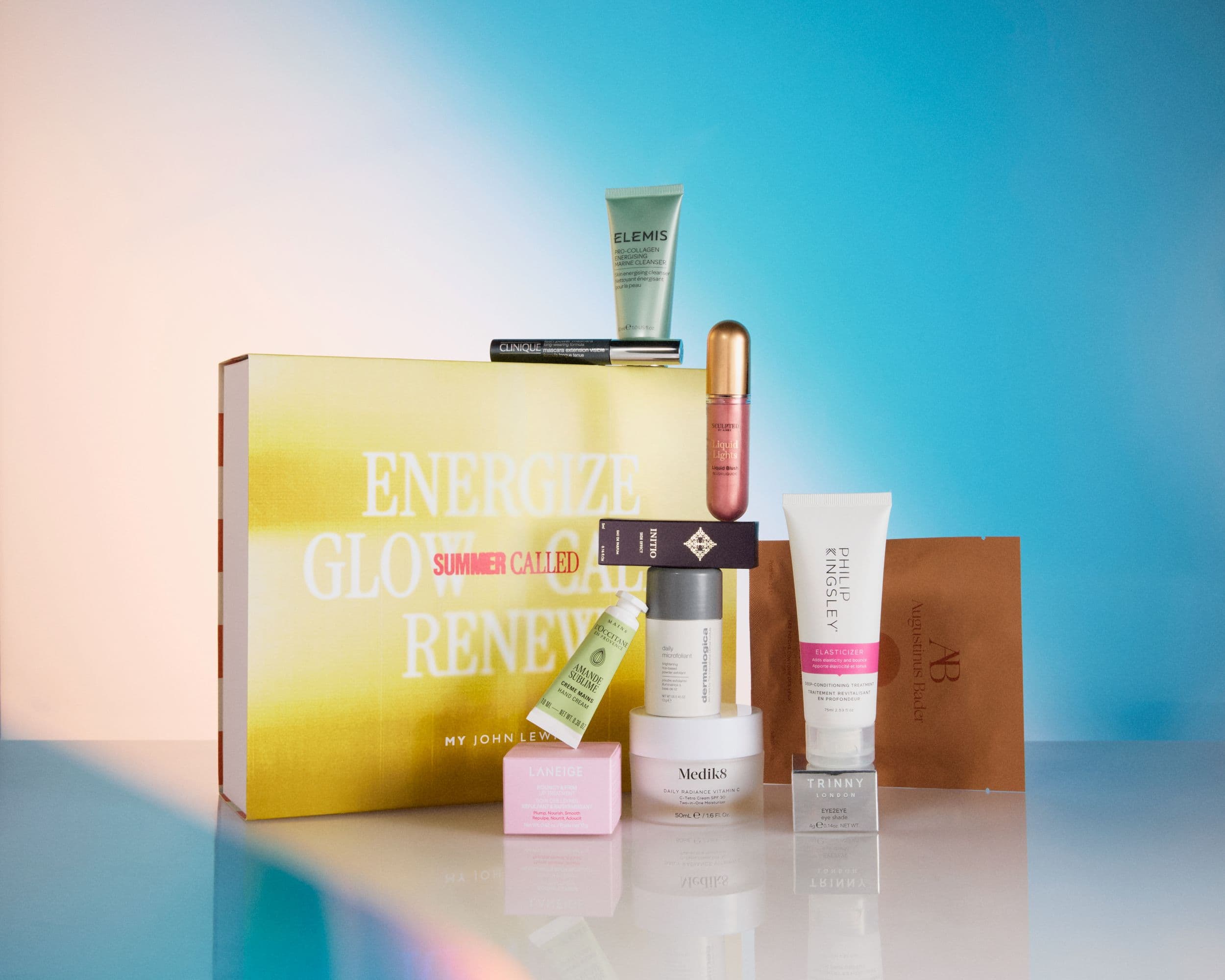 Assorted skincare and beauty products against gradient backdrop