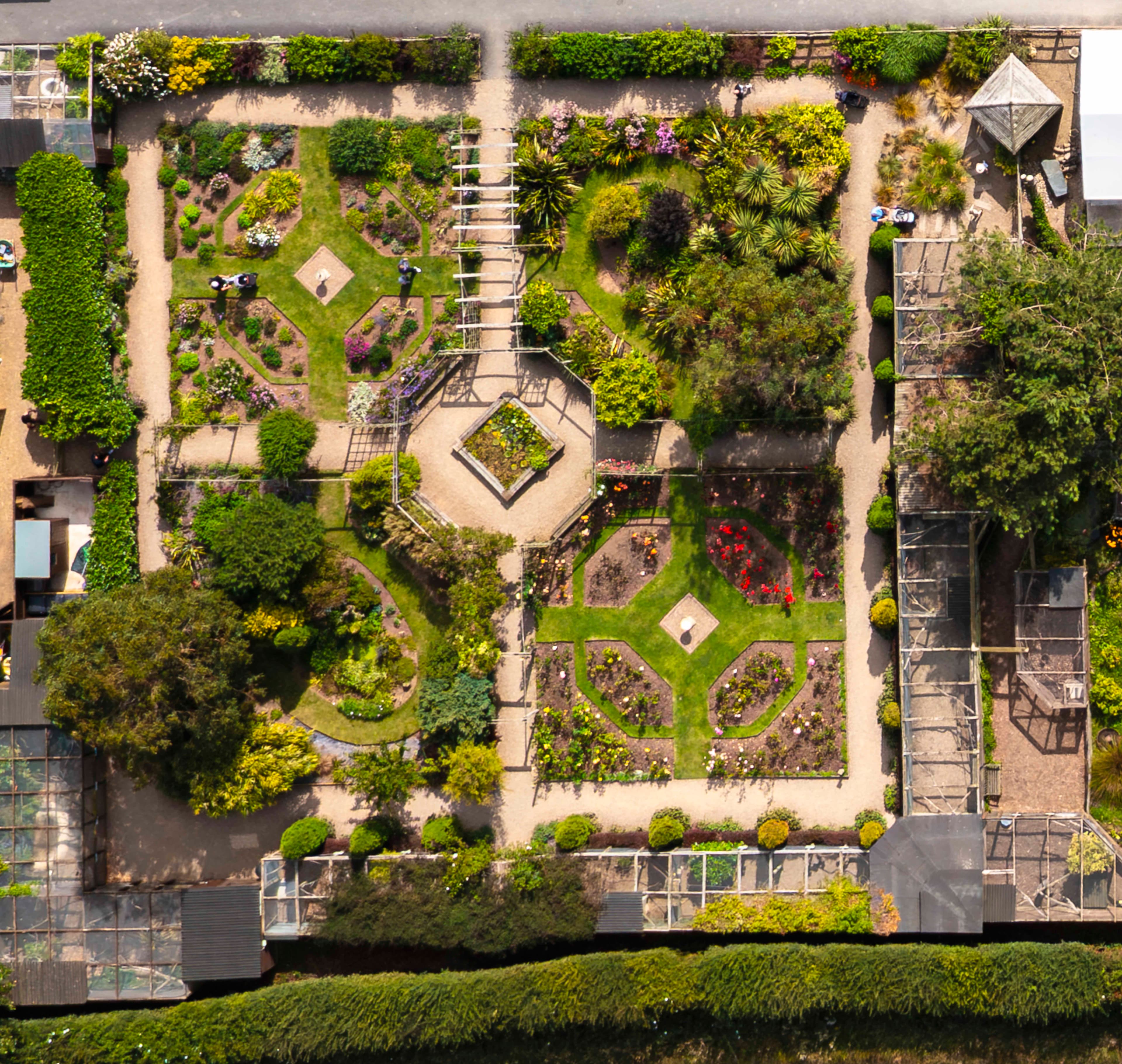 Aerial view of Filey Zoo's lush gardens with intricate pathways and vibrant flower beds