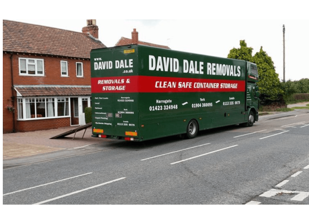 Green removal truck with "David Dale Removals" branding parked by a residential street in Milby, Yorkshire.