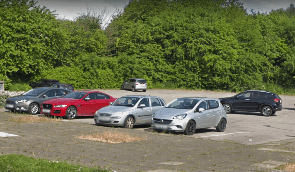 Pay & Display parking area in Shafton, Yorkshire, with several parked cars and greenery in the background.