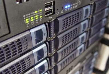 Close-up of server racks with LED indicators and USB ports, showcasing tech equipment at Fusion Systems in York.