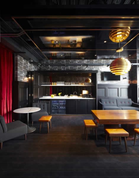Stylish interior of Everyman Cinema Leeds, featuring modern seating, wooden tables, and ambient lighting.