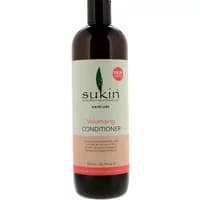 Sukin Volumising Conditioner 500ml in a dark brown bottle with a green leaf logo and peach label.
