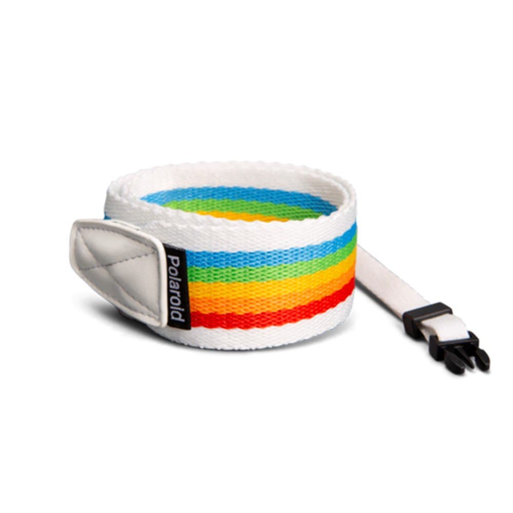 Flat rainbow camera strap featuring vibrant horizontal stripes in red, orange, yellow, green, and blue, with a white woven fabric and a Polaroid logo tag.