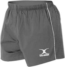 Black rugby shorts made of lightweight material, featuring an elastic waistband and the Gilbert logo on the lower left side, with a contrasting white trim along the side.