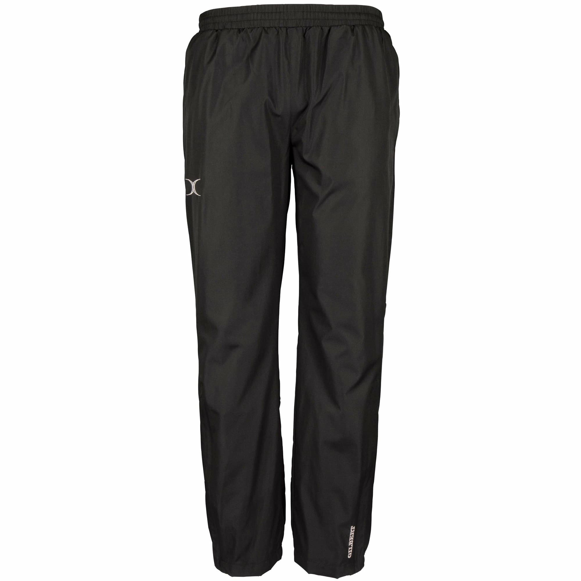 Black training trousers made from lightweight material, featuring an elastic waistband and the Gilbert Rugby logo on the left leg.