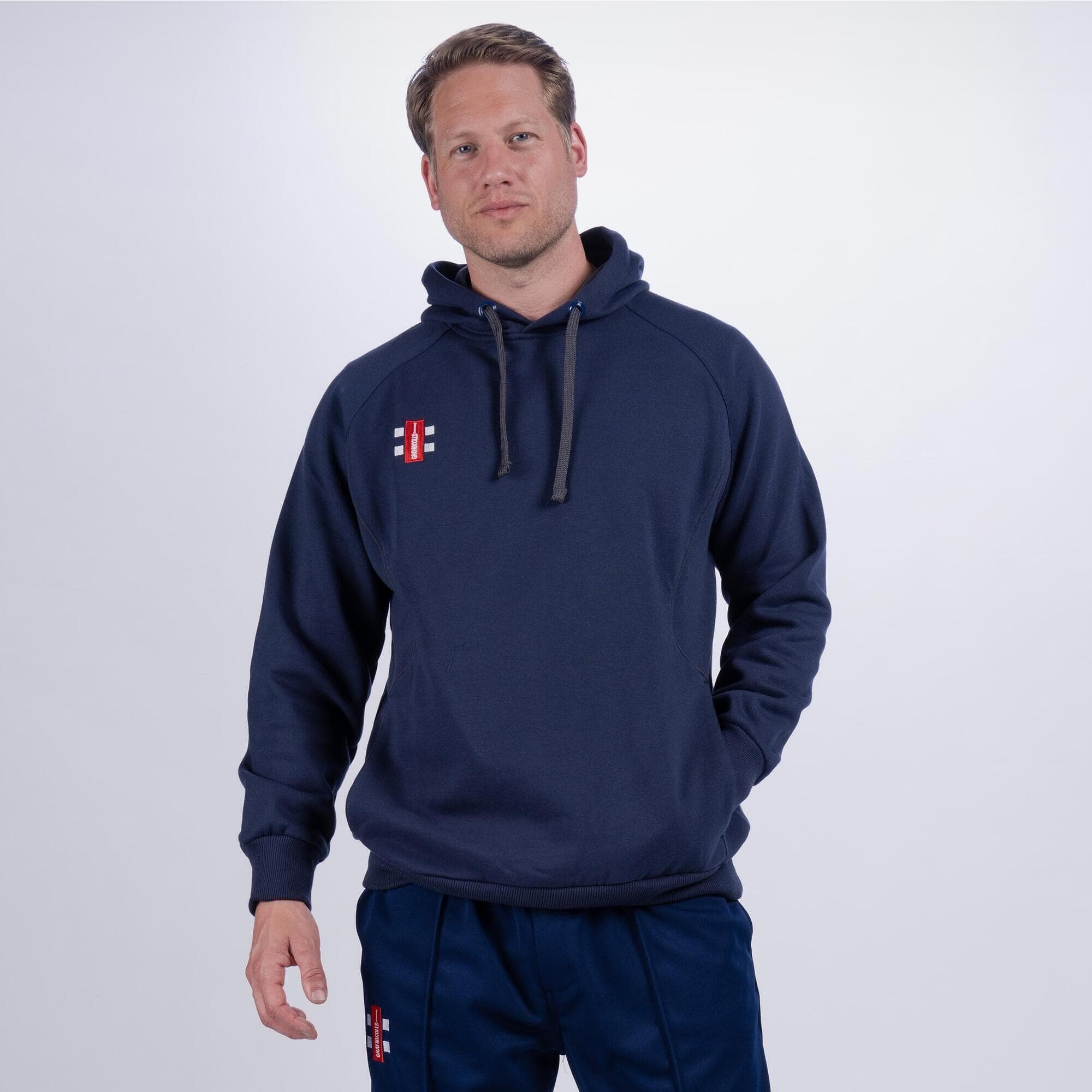 Black Gray-Nicolls Storm Hoodie featuring a drawstring hood, ribbed cuffs, and a logo on the chest, made from soft, durable material ideal for sports and casual wear.