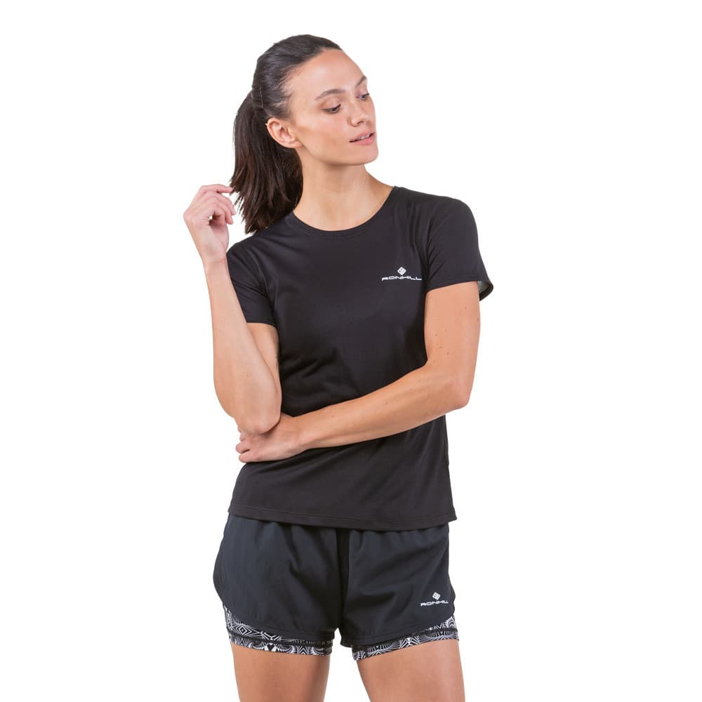Black women's shorts with a lightweight, breathable material, featuring a comfortable fit and a stylish monochrome design, paired with a matching black short-sleeve top.