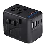 Black Bigfish travel adapter with EU, UK, US, AUS plugs, 2 USB A, 2 USB C ports, dual 10A fuses, compact design.