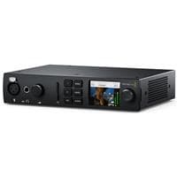 Blackmagic Design UltraStudio 4K Mini is a sleek black video capturing device with a compact design, featuring a display screen, various input/output ports, and control buttons on the front.