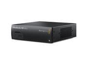 Compact black audio interface with a sleek design, featuring ventilation grilles on the side and a front panel with a slot for connectivity options.