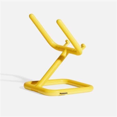 Adjustable yellow tablet stand with a sturdy, modern design featuring a square base and ergonomic arms for versatile positioning.