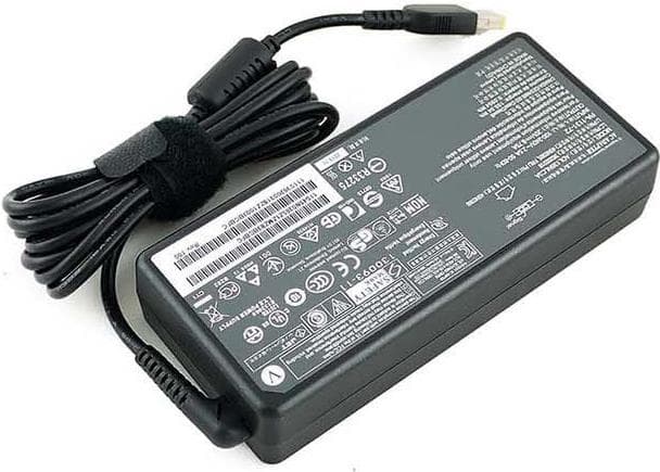 Black Lenovo 36200605 power adapter with a 135 W output, featuring a textured surface, a coiled cable, and various technical specifications printed on the side.