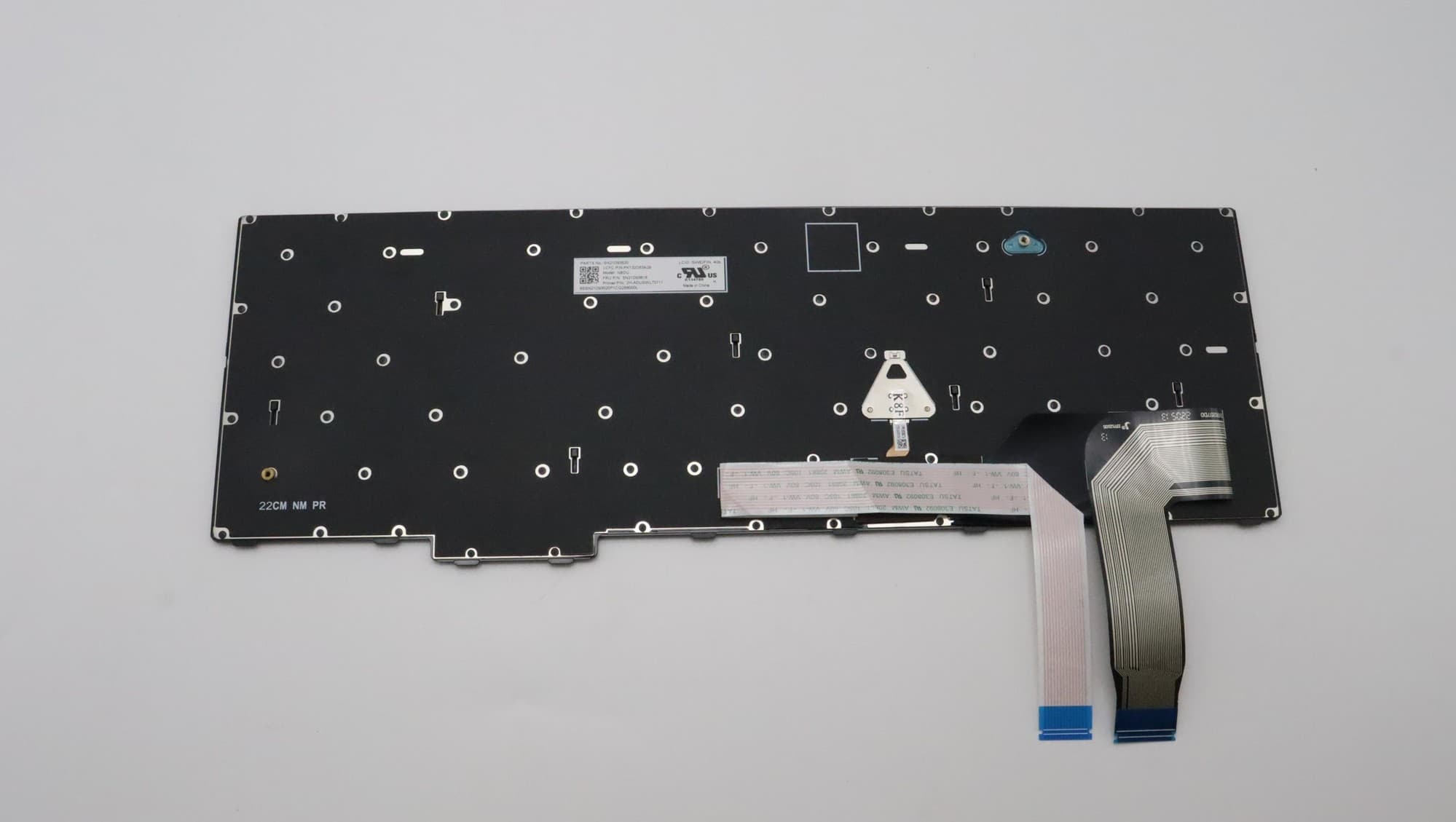 Black Lenovo laptop keyboard spare part with a flexible ribbon cable, featuring multiple mounting holes and a label on the back for identification.