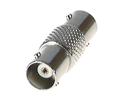 Silver BNC female-to-female coaxial connector with a smooth metallic finish, featuring knurled grip and two connection ports for 75 Ω applications.