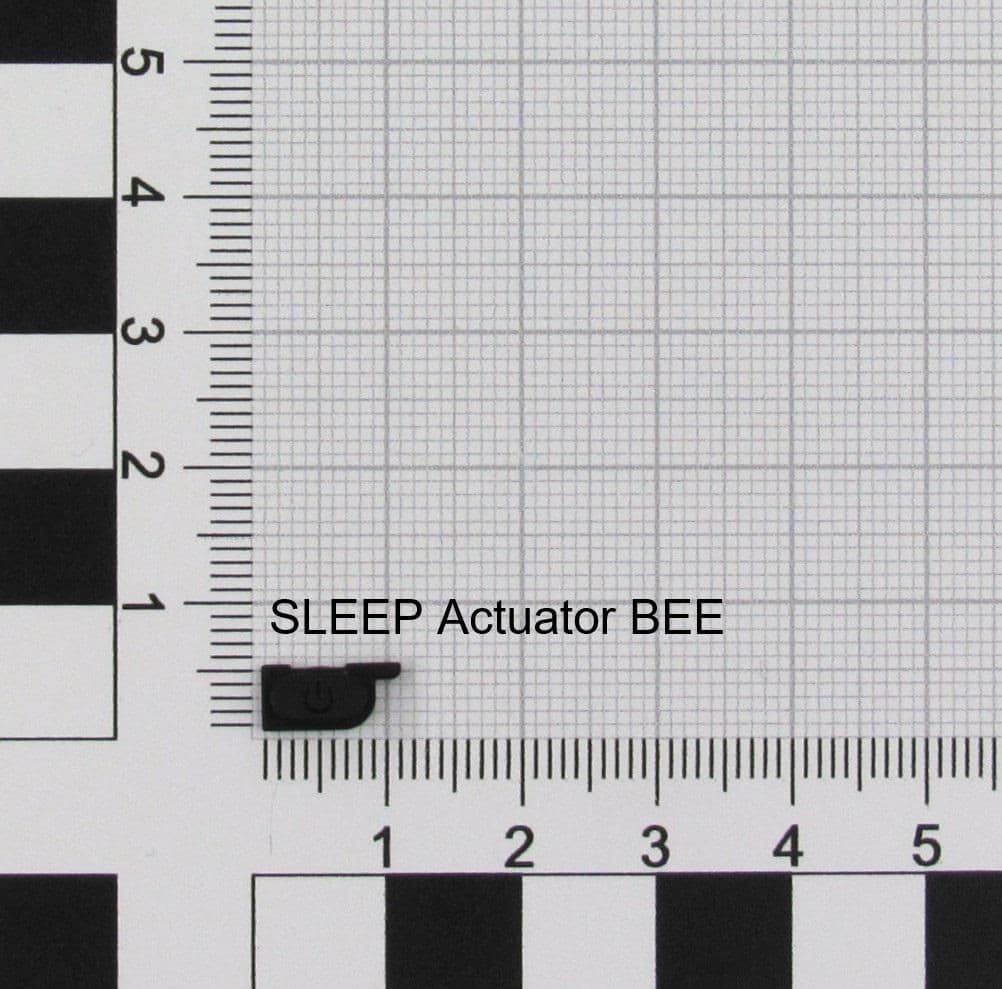 Black plastic SLEEP actuator labeled "SLEEP Actuator BEE," with a small, rectangular shape, positioned on a grid background with measurement markings.