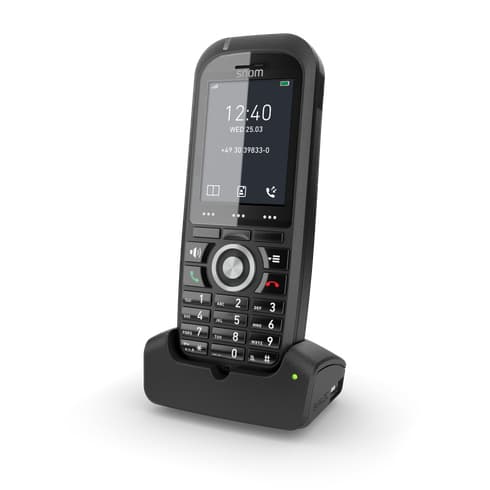 Black Snom M70 IP DECT handset with a sleek design, featuring a large display, numeric keypad, and Bluetooth capability, resting in a matching charging dock.