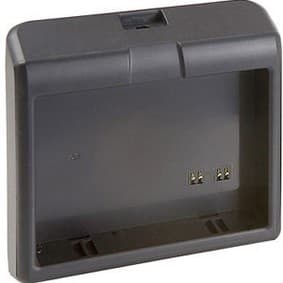 Black plastic battery charger with a rectangular shape, featuring two metal contacts inside for charging and a slot on top for battery insertion.