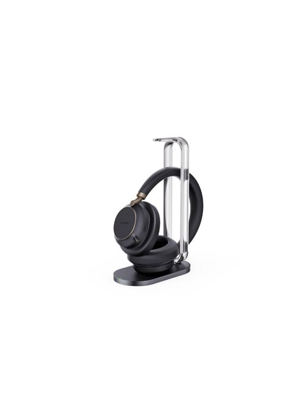 Yealink BH76 Plus UC headset in black with a sleek charging stand, featuring cushioned ear cups and a modern design, ideal for professional use.