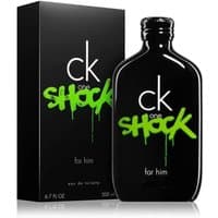 Black CK ONE SHOCK FOR HIM bottle with green graffiti text, next to matching black box, 100ml eau de toilette.