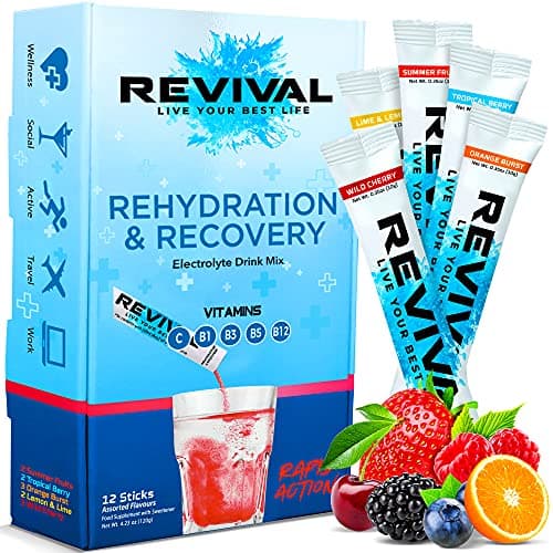 Bright blue box labeled "REVIVAL" with "Rehydration & Recovery" text, containing colorful sachets in flavors like Summer Fruit and Tropical Berry, featuring vitamins B1, B3, B5, B12.