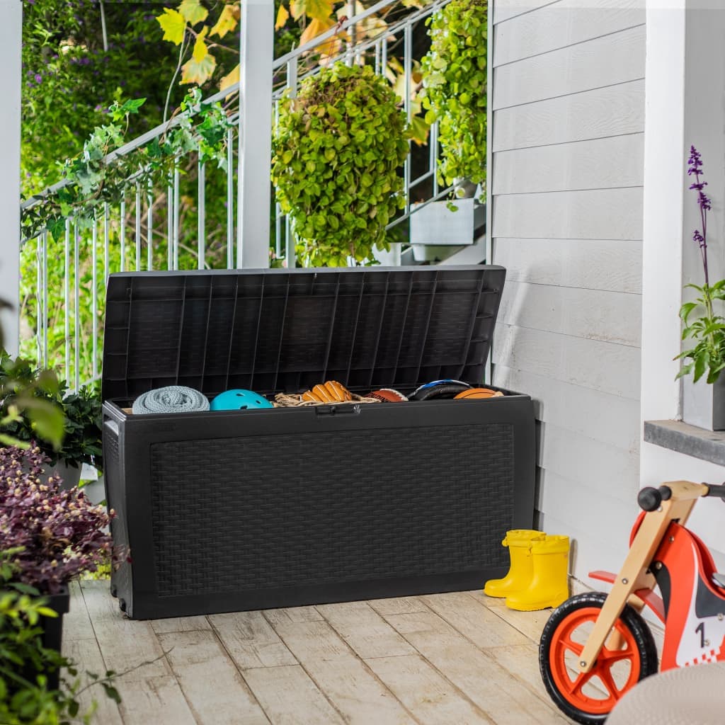 Anthracite-colored Keter Samoa plastic garden storage box, measuring 3'10" x 1'6", features a textured design and a spacious interior for outdoor storage, placed on a wooden deck.