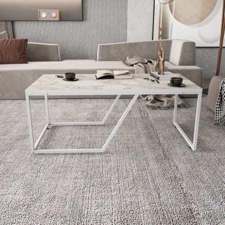 Wendy Metal Leg Coffee Table in Ephesus White features a sleek white metal frame with a textured light-colored top, set in a modern living room with neutral-toned furnishings.