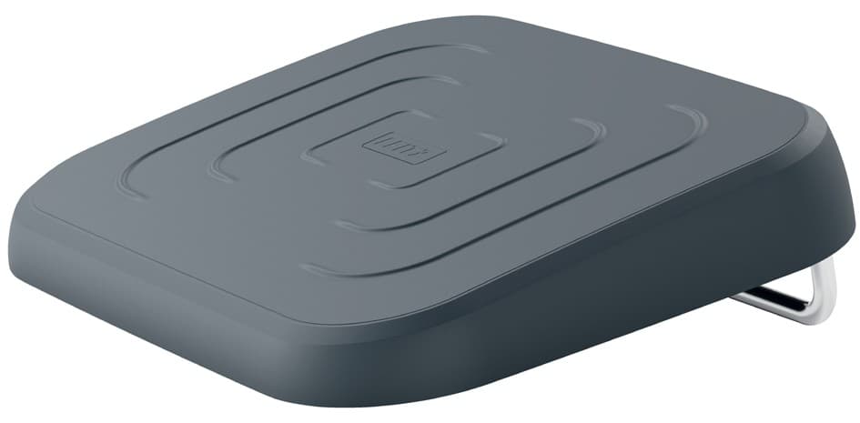 Ergonomic adjustable footrest in black with a textured surface and curved edges, featuring a sturdy metal base for stability in an office setting.
