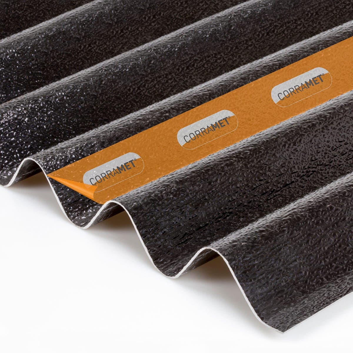 Black corrugated roof sheet kit measuring 950 x 2500mm, featuring a textured surface and a prominent orange label with "CORRAMET" branding.