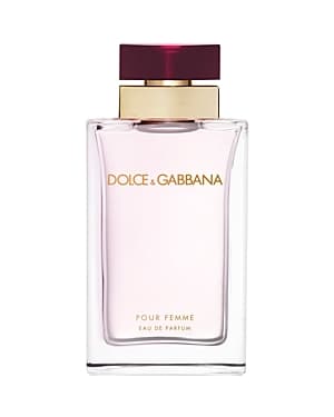 Clear glass bottle with a pink liquid, featuring a gold and burgundy cap, labeled "DOLCE & GABBANA POUR FEMME" in elegant font, 3.3 oz Eau De Parfum for women.