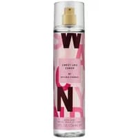 Clear bottle of ARIANA GRANDE Sweet Like Candy Body Mist, pink label with bold letters, gold spray nozzle, 236ml.