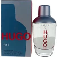 Clear glass bottle of Hugo Boss Hugo Iced Eau De Toilette, silver cap, red logo, next to dark blue box.