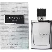 Clear glass bottle with black cap, silver accents, next to textured silver box labeled "Jimmy Choo Man Eau De Toilette."