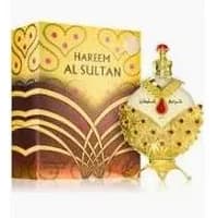 Khadlaj Hareem Al Sultan Gold perfume oil, ornate gold bottle with red gem, matching decorative box.