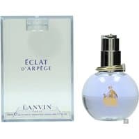Round glass bottle with silver cap, purple liquid, Lanvin Eclat D'Arpege text, and matching box with logo.