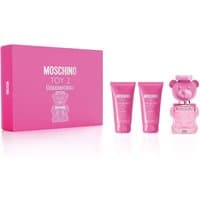 Moschino Toy 2 Bubble Gum set with pink teddy bear-shaped EDT bottle, matching pink body lotion, and shower gel tubes.