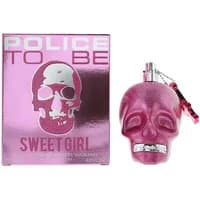 Pink skull-shaped Police To Be Sweet Girl perfume bottle with matching pink box featuring skull design.