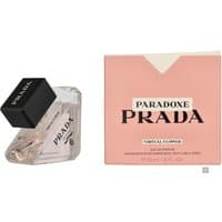 Clear glass Prada Paradoxe bottle with black cap, pink box with bold Prada logo and floral design.