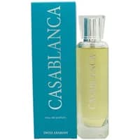 Clear glass bottle with yellow perfume, silver cap, next to turquoise box labeled "Casablanca" in white text.