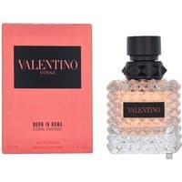 Valentino Donna Coral Fantasy perfume, 50ml, in a textured glass bottle with black cap, beside a coral-colored box.