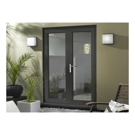Finished grey slimline French doors measuring 1490mm, featuring sleek glass panels, a modern handle, and surrounded by indoor plants and contemporary wall lights.