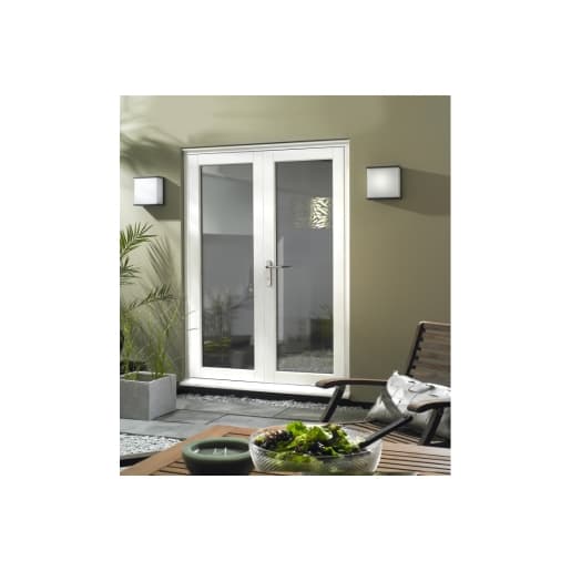 White slimline French doors, 1490mm wide, featuring a sleek design with glass panels, set against a neutral wall, complemented by modern outdoor decor.