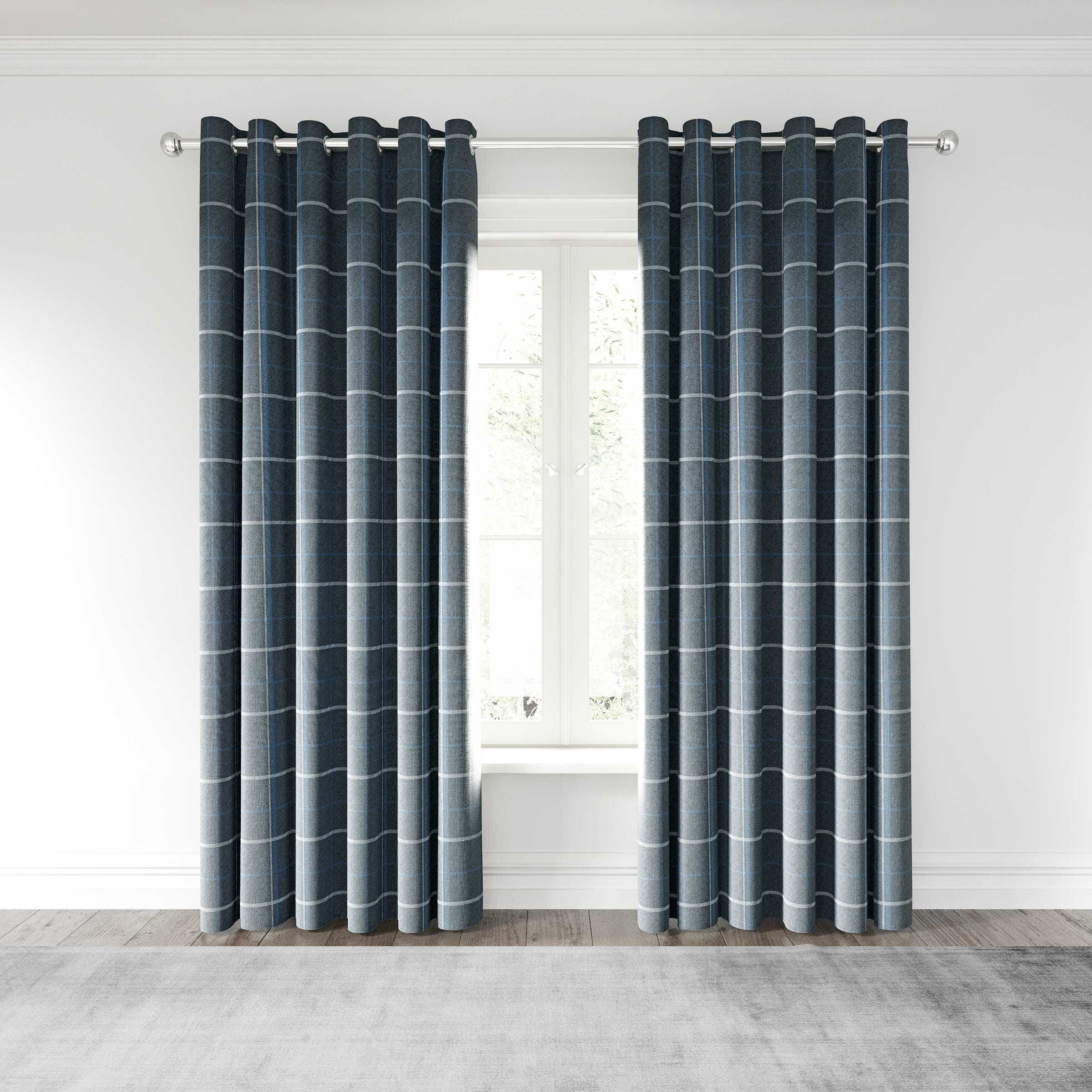 Dark navy woven lined curtains with a grid pattern, featuring a 167cm width and 228cm drop, hang elegantly from a silver curtain rod in a bright room.