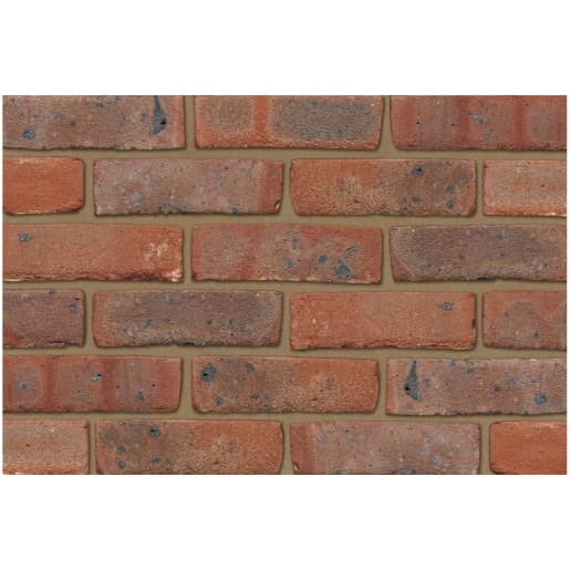 Mixed stock bricks in various shades of red and brown, featuring a textured surface with subtle variations and speckles, suitable for construction projects.