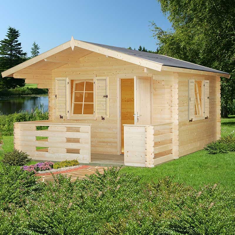 Light-colored wooden log cabin with a sloped roof, featuring open windows, a front porch, and surrounded by greenery and a serene water view.
