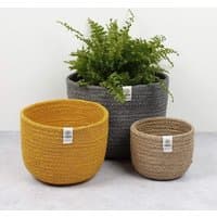 Set of three jute baskets in yellow, gray, and beige, each with a woven texture and Respiin label.