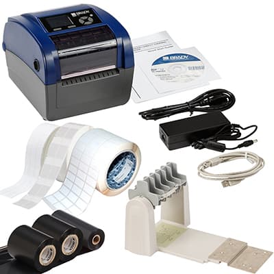 Brady BBP12 label printer in blue and gray, with power supply, USB cable, labels, and a roll holder, showcasing direct thermal and thermal transfer capabilities.