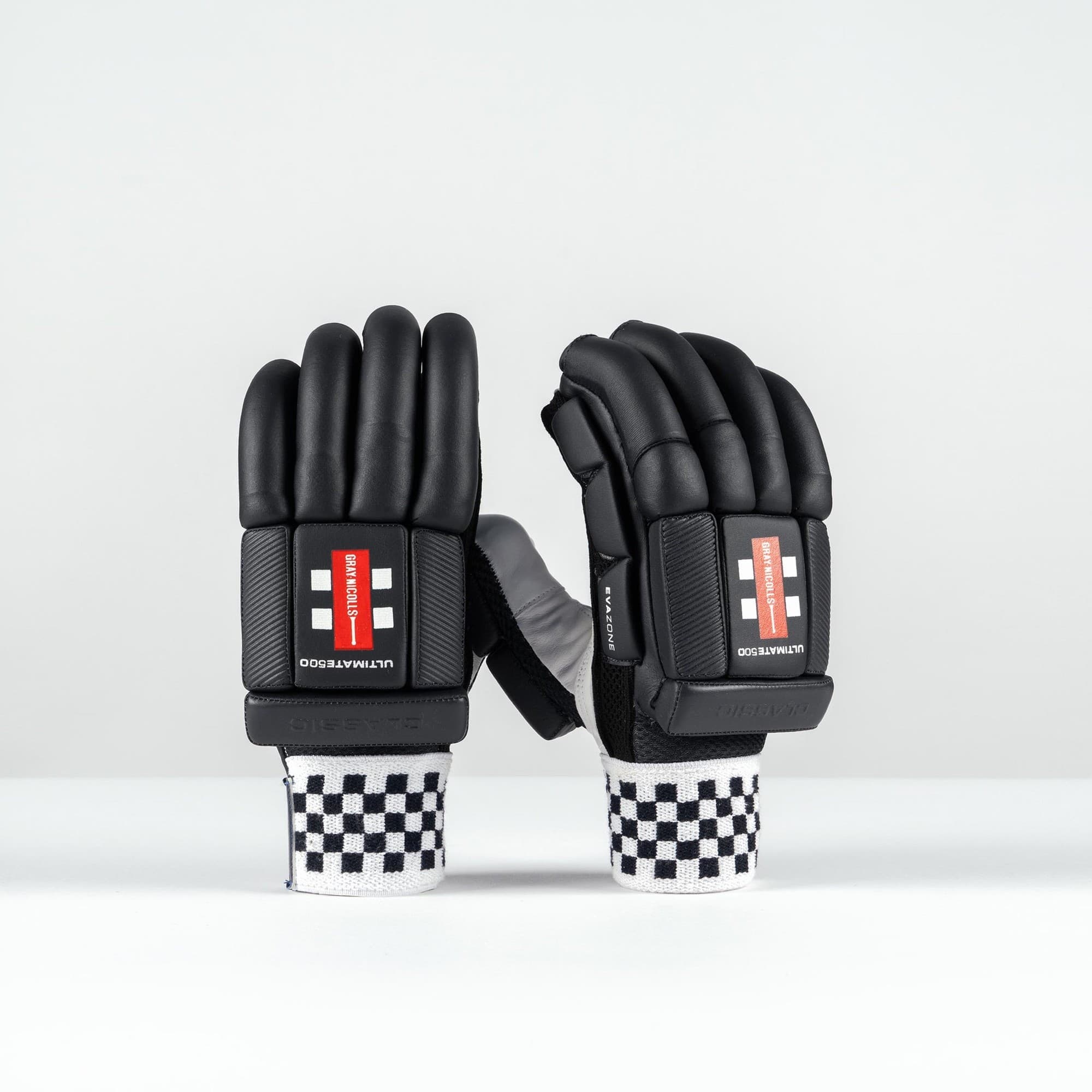 Gray-Nicolls Classic Ultimate 500 adult batting gloves in white, featuring a sleek design, padded black fingers, and a checkered wrist strap for added support.