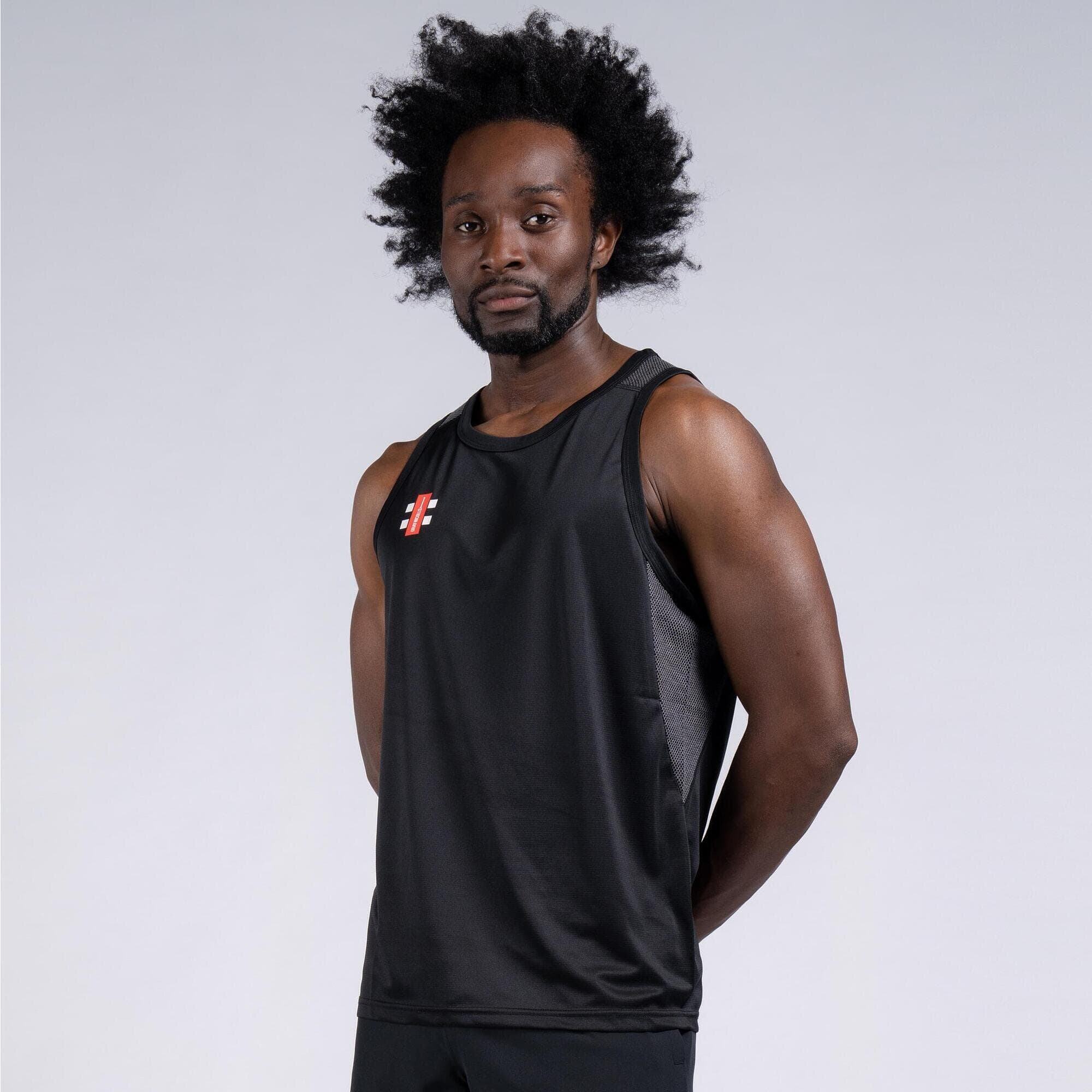 Black sleeveless vest made of lightweight material, featuring the Gray-Nicolls logo on the chest, designed for performance and comfort in sports activities.