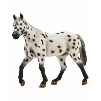 Leopard Appaloosa stallion figurine with a white body covered in black spots, detailed mane and tail, and brown hooves, crafted from durable plastic.